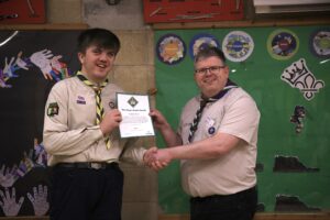 Ben is presented with his King's Scout Award by County Lead Volunteer, Paul Wakeley